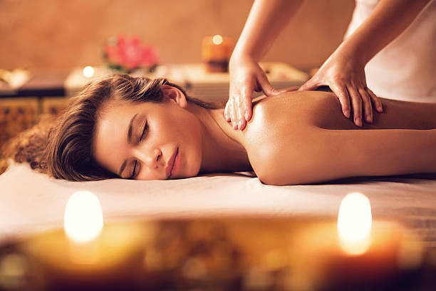 Beautiful woman receiving back massage at the spa